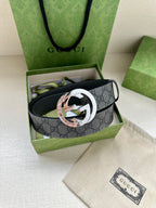 Gucci belt with dark gray GG monogram strap and multitone silver and rose logo buckle
