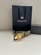 Versace belt with gold-blue patterned strap and gold lion buckle, front view