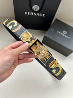 Designer belt with navy patterned strap and gold baroque medallion buckle