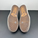 Low-top sneakers outsole view, brown patterned tread with molded traction grooves