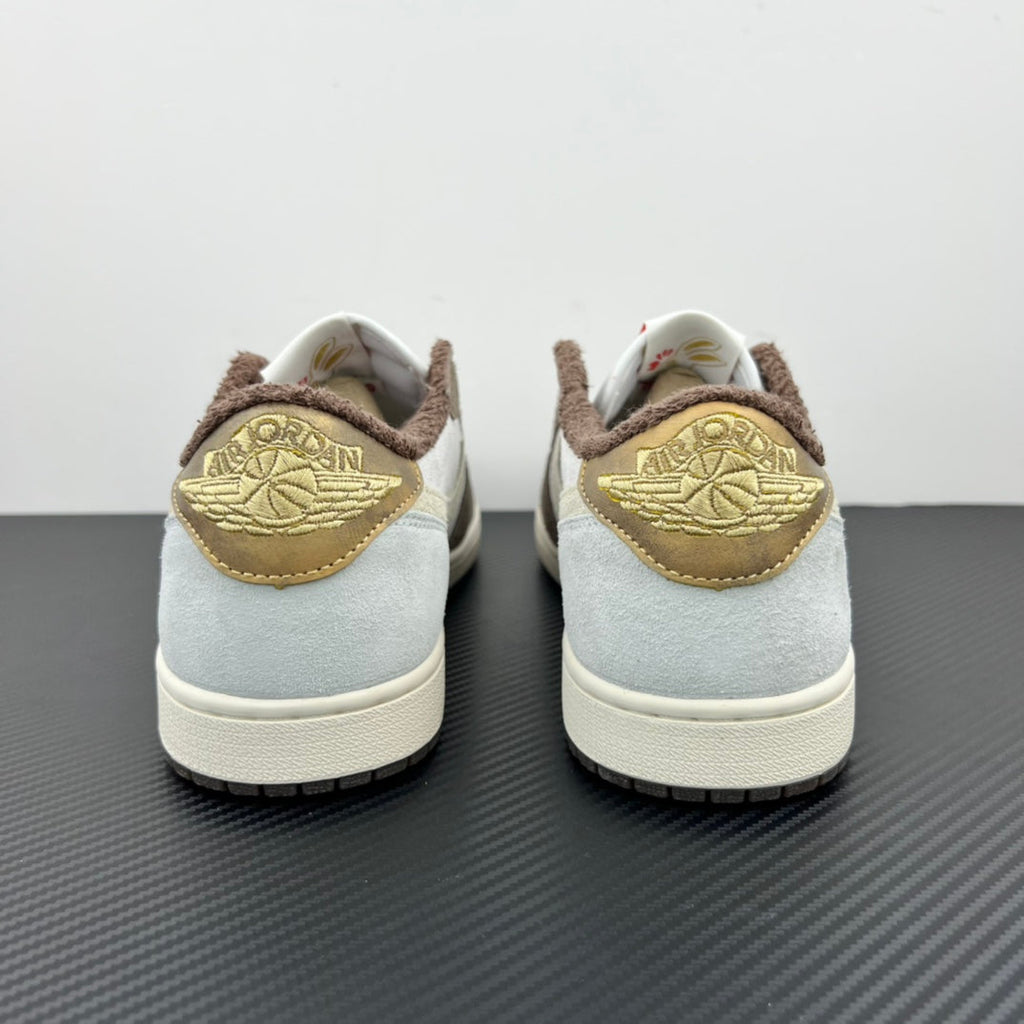 Low-top sneakers back view, white leather with brown suede and gold embroidered detail