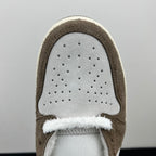 Low-top sneakers toe box close-up, perforated white leather with brown suede trim