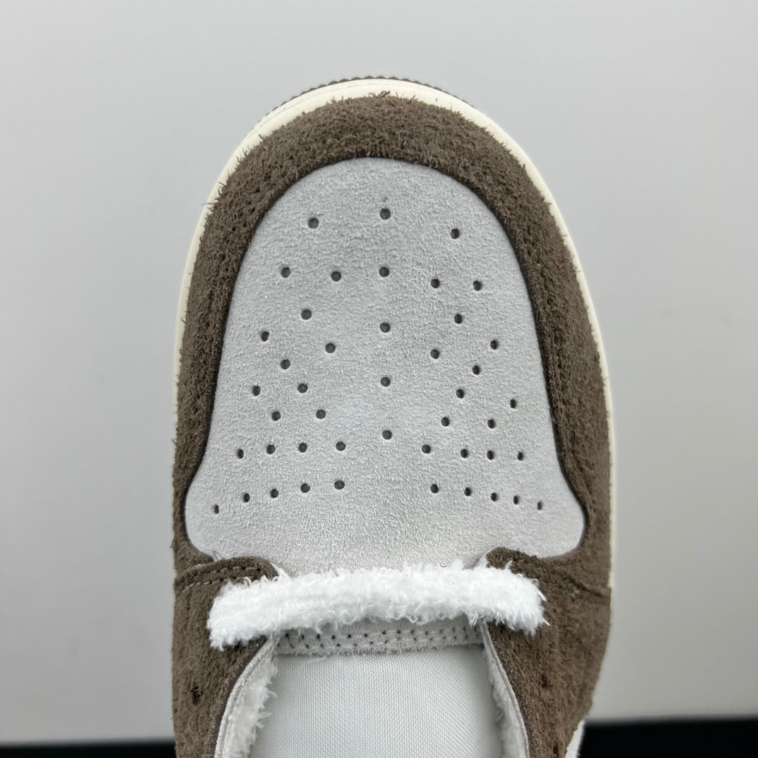 Low-top sneakers toe box close-up, perforated white leather with brown suede trim