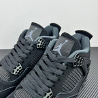 Air Jordan 4 sneakers close-up of laces, mesh quarter panel, and lace cage details