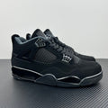 Air Jordan 4 sneakers in dark navy/black with mesh panel and lace-up closure