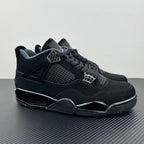 Air Jordan 4 sneakers in dark navy/black with mesh panel and lace-up closure
