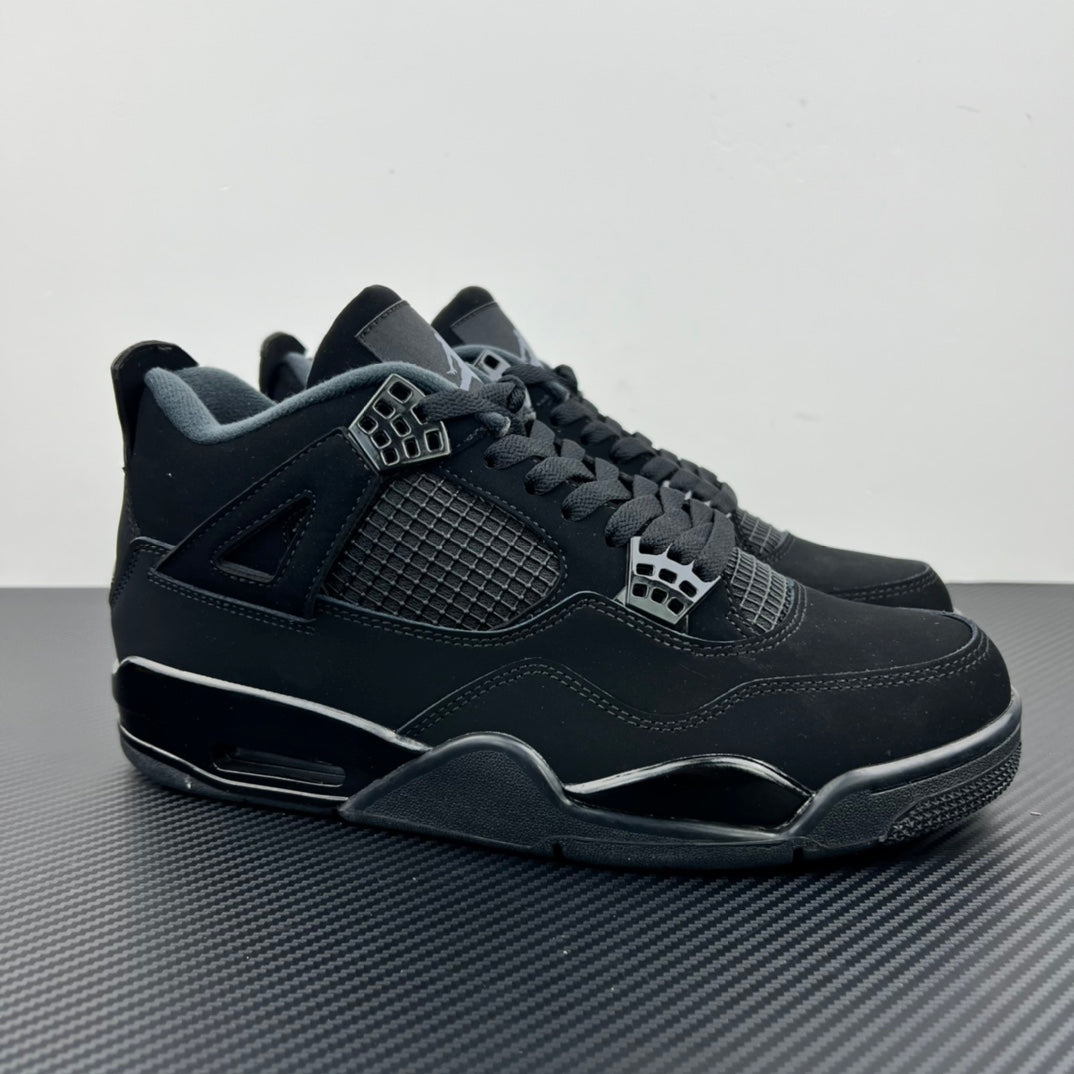 Air Jordan 4 sneakers in dark navy/black with mesh panel and lace-up closure