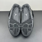 Air Jordan 4 outsole tread view with molded pattern and Jumpman logo on footbed