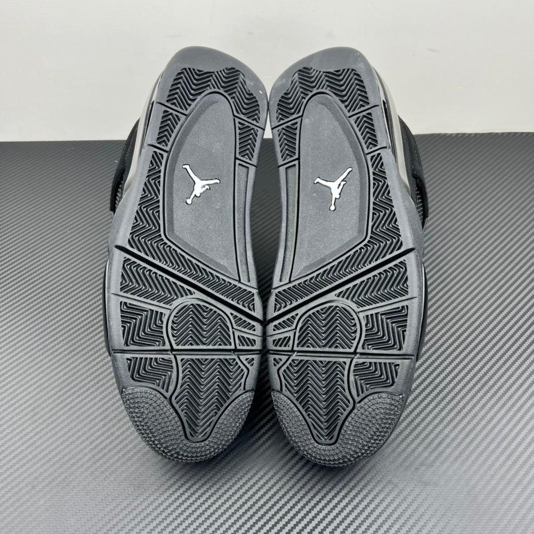 Air Jordan 4 outsole tread view with molded pattern and Jumpman logo on footbed