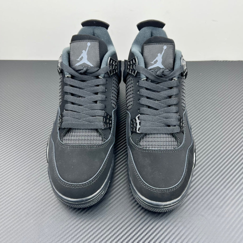 Pair of Air Jordan 4 sneakers front view with lace-up closure and padded collar