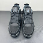 Pair of Air Jordan 4 sneakers front view with lace-up closure and padded collar