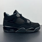 Mid-top Air Jordan 4 sneaker with dark upper, mesh side panel, and visible air unit