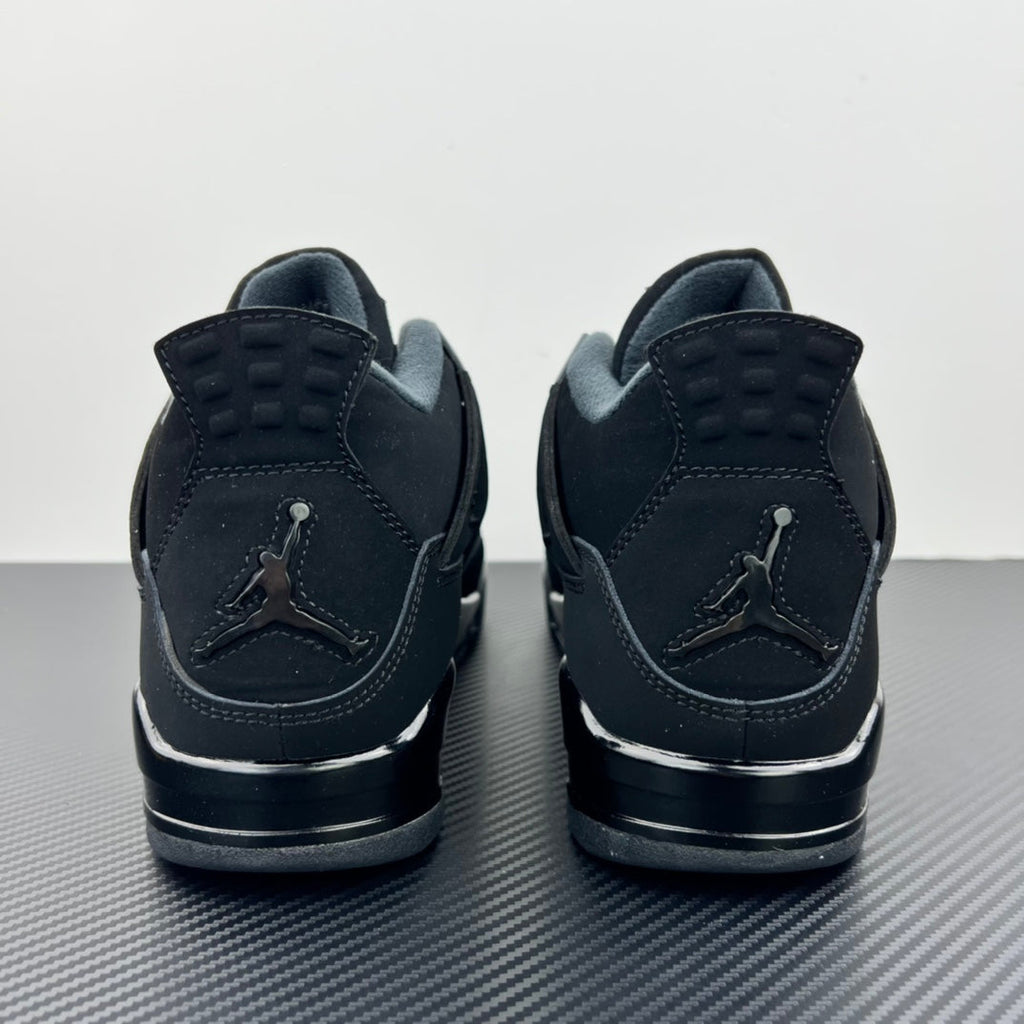 Air Jordan 4 sneakers heel view with rear Jumpman logo and cushioned collar