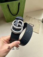 Gucci belt strap detail in dark navy with embossed GG pattern and silver double G buckle