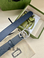 Gucci leather belt in dark navy with silver double G buckle, laid flat for view