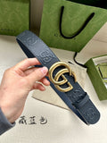 Gucci belt with dark blue strap, perforated GG logo texture and gold-tone buckle