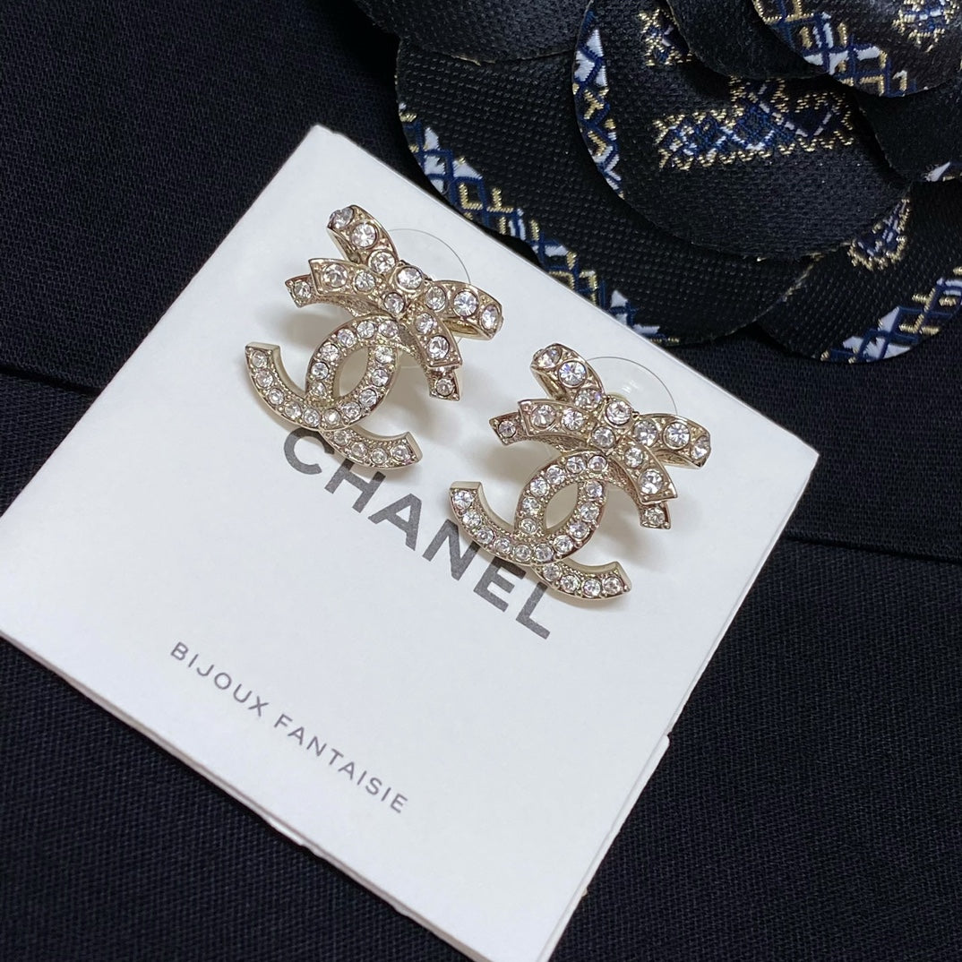 Rhinestone CC logo stud earrings with silver-toned metal and clear crystal detailing