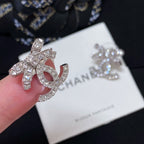 Rhinestone CC logo stud earring with silver-toned metal and pink enamel center