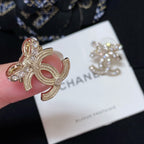 Rhinestone CC logo stud earring with gold-tone metal and pink enamel accents