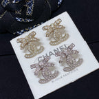 Rhinestone CC logo stud earrings with silver-toned finish and clear crystals