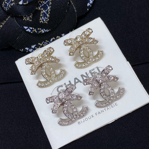 Rhinestone CC logo stud earrings with silver-toned finish and clear crystals
