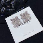 Rhinestone CC logo stud earrings with silver-toned metal and pale pink enamel accents