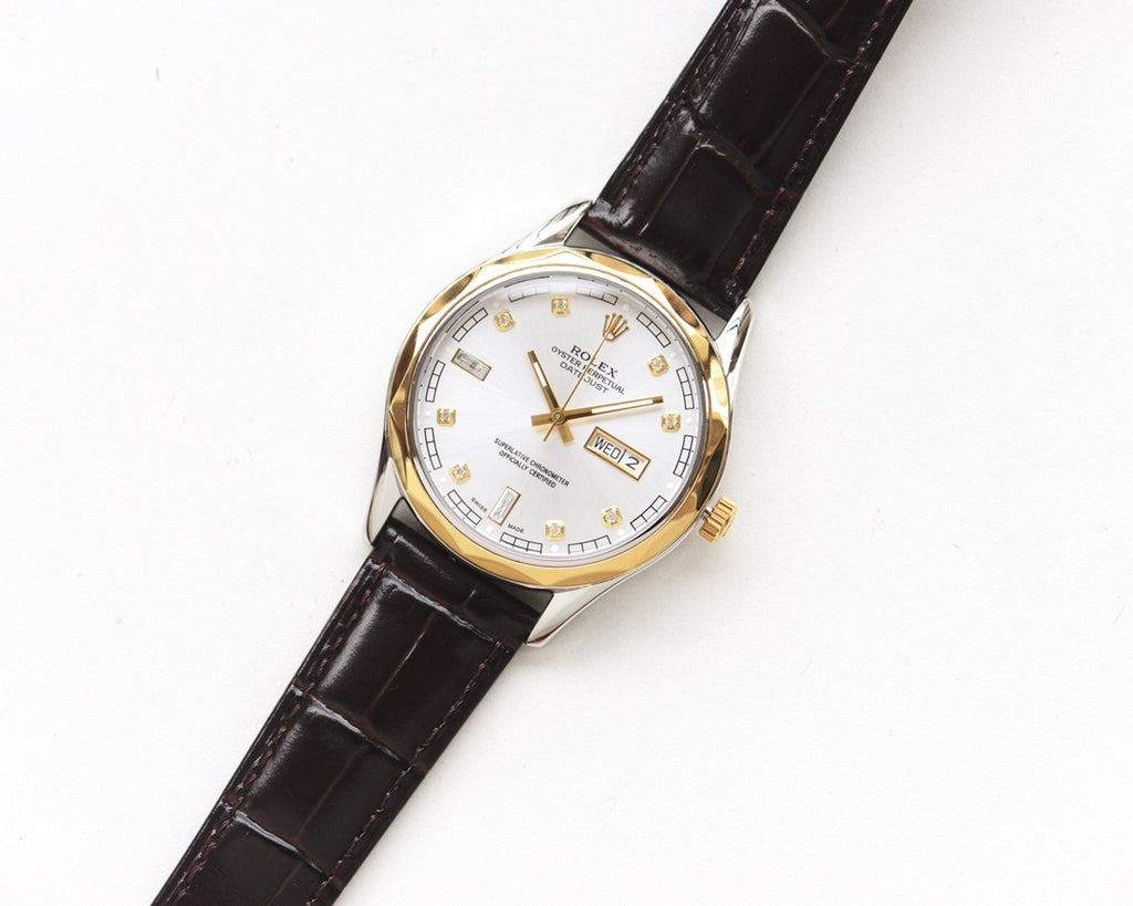 Rolex wristwatch with white dial, gold hands, black leather strap