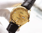 Rolex wristwatch with gold dial, gold markers, black leather strap