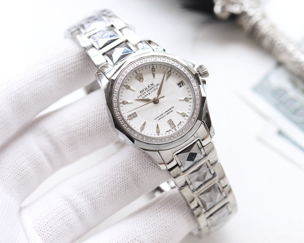 Rolex wristwatch with white dial, gold hands, stainless steel bracelet and bezel.