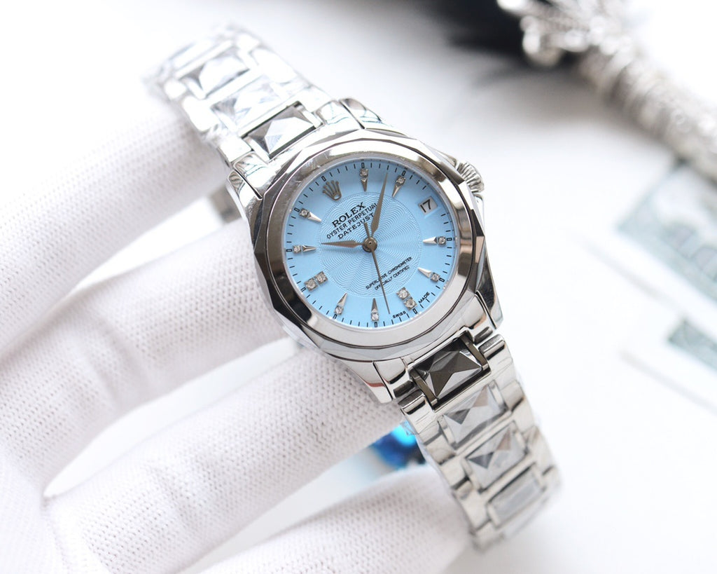Rolex wristwatch with light blue dial, gold hands, stainless steel bracelet links.