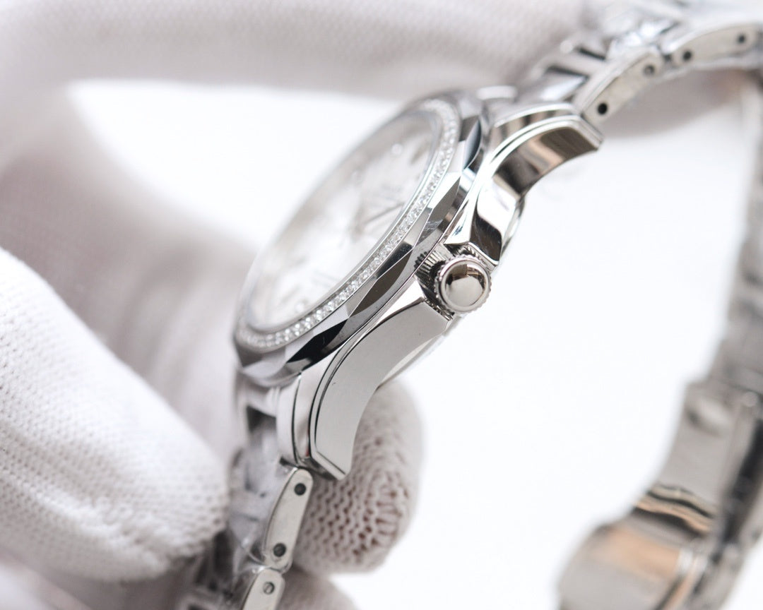 Rolex wristwatch side view with crown, stainless steel case and bracelet links.