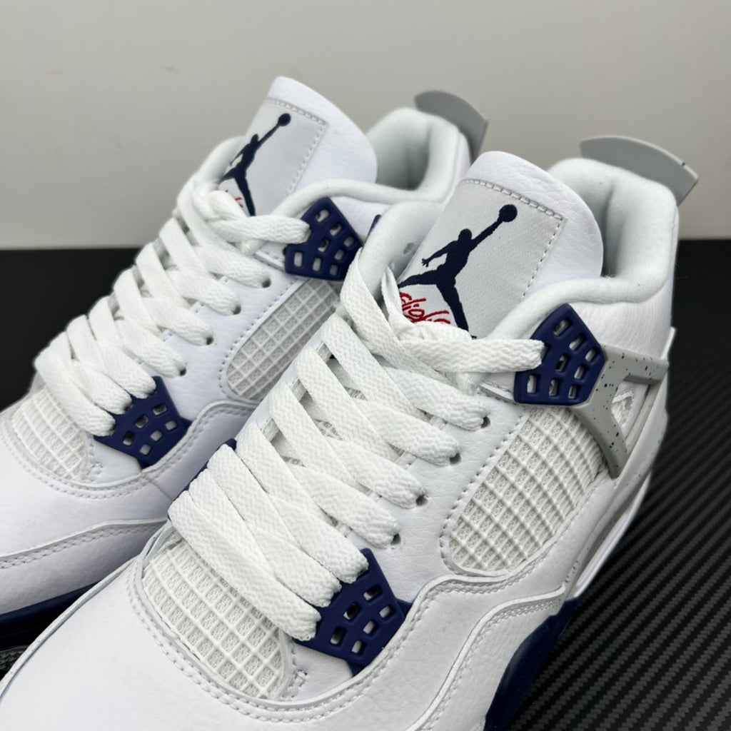 White Air Jordan 4 sneakers close-up with blue eyelets and woven side panel