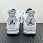 Air Jordan 4 sneakers from heel view in white with navy Jumpman logos