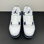 Pair of white Air Jordan 4 sneakers with navy detailing and lace-up design