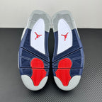 Air Jordan 4 outsole view with navy traction pattern and red heel pods