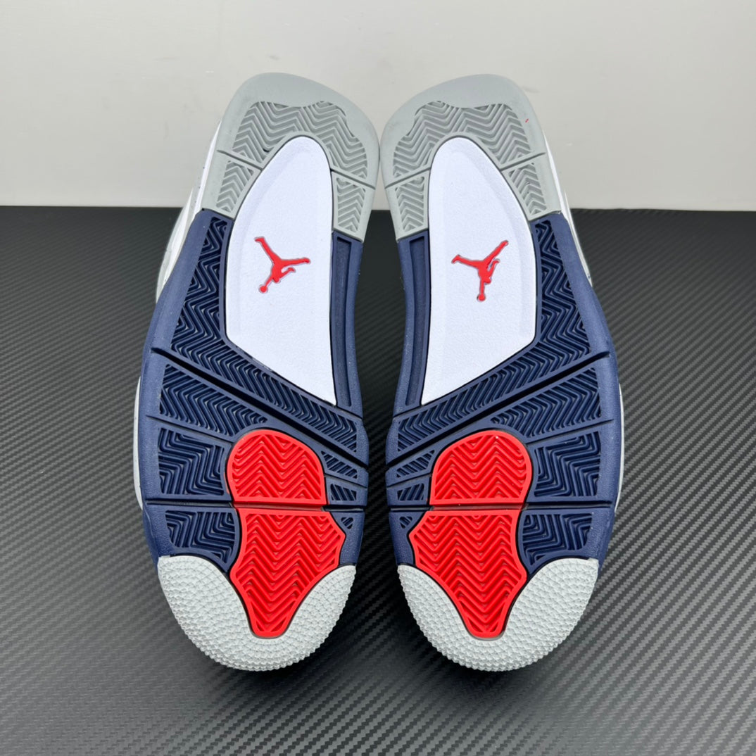 Air Jordan 4 outsole view with navy traction pattern and red heel pods