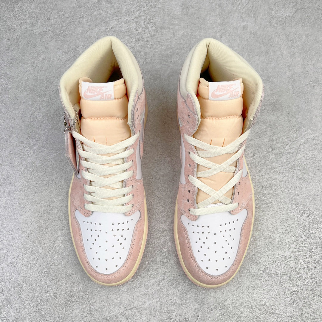 Pair of Air Jordan 1 Retro High OG high-top sneakers with pink panels, white laces, cream trim