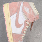 Air Jordan 1 Retro High OG side close-up with white swoosh, pink suede, and Air logo
