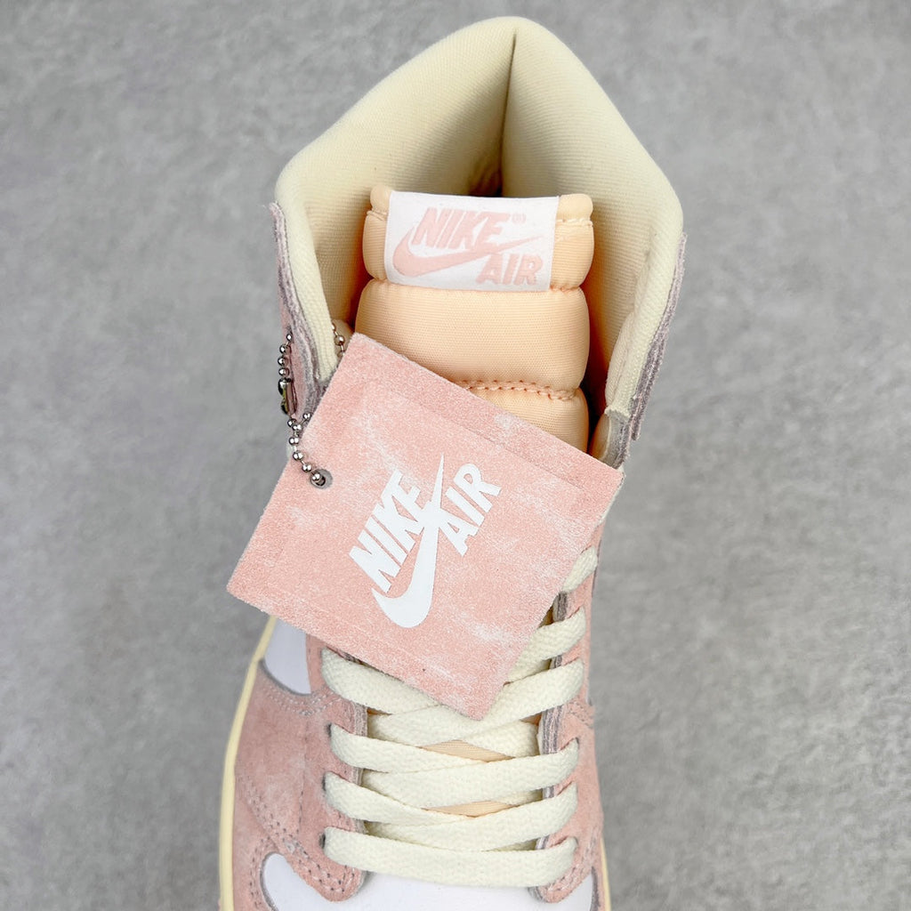 Air Jordan 1 Retro High OG inside collar view with pink suede tongue tag and cream lining