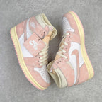 Two Air Jordan 1 Retro High OG sneakers shown at an angle with pink suede and white swooshes
