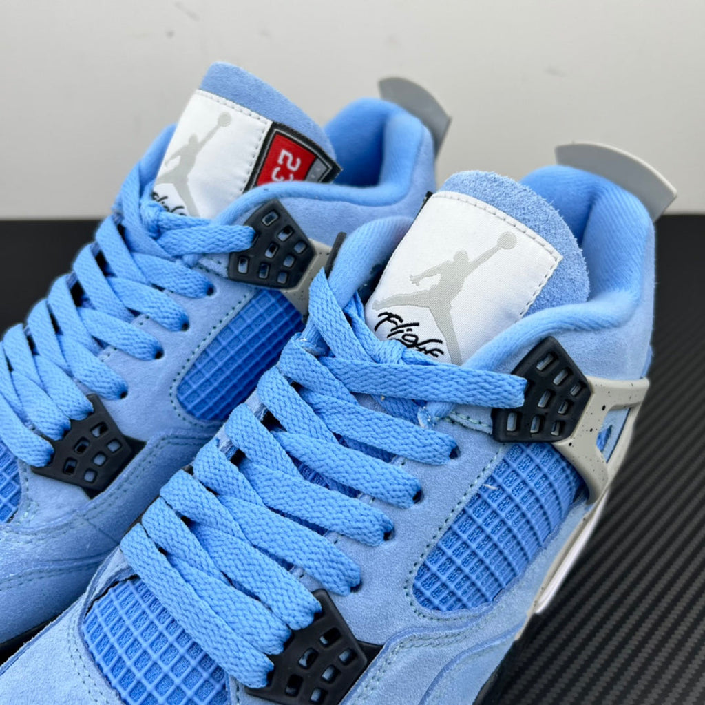 Light blue Air Jordan 4 sneakers with white wing logo and black lace locks