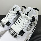 Pair of white Air Jordan 4 sneakers with black Jumpman logos and mesh side panels