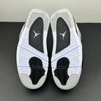 Air Jordan 4 outsole with white tread and black traction pods at the forefoot