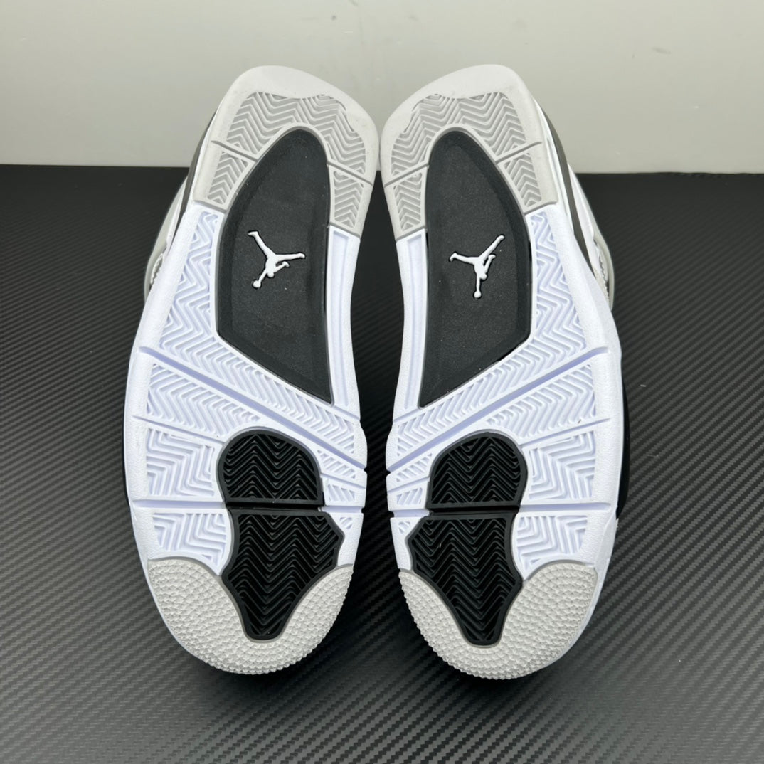 Air Jordan 4 outsole with white tread and black traction pods at the forefoot