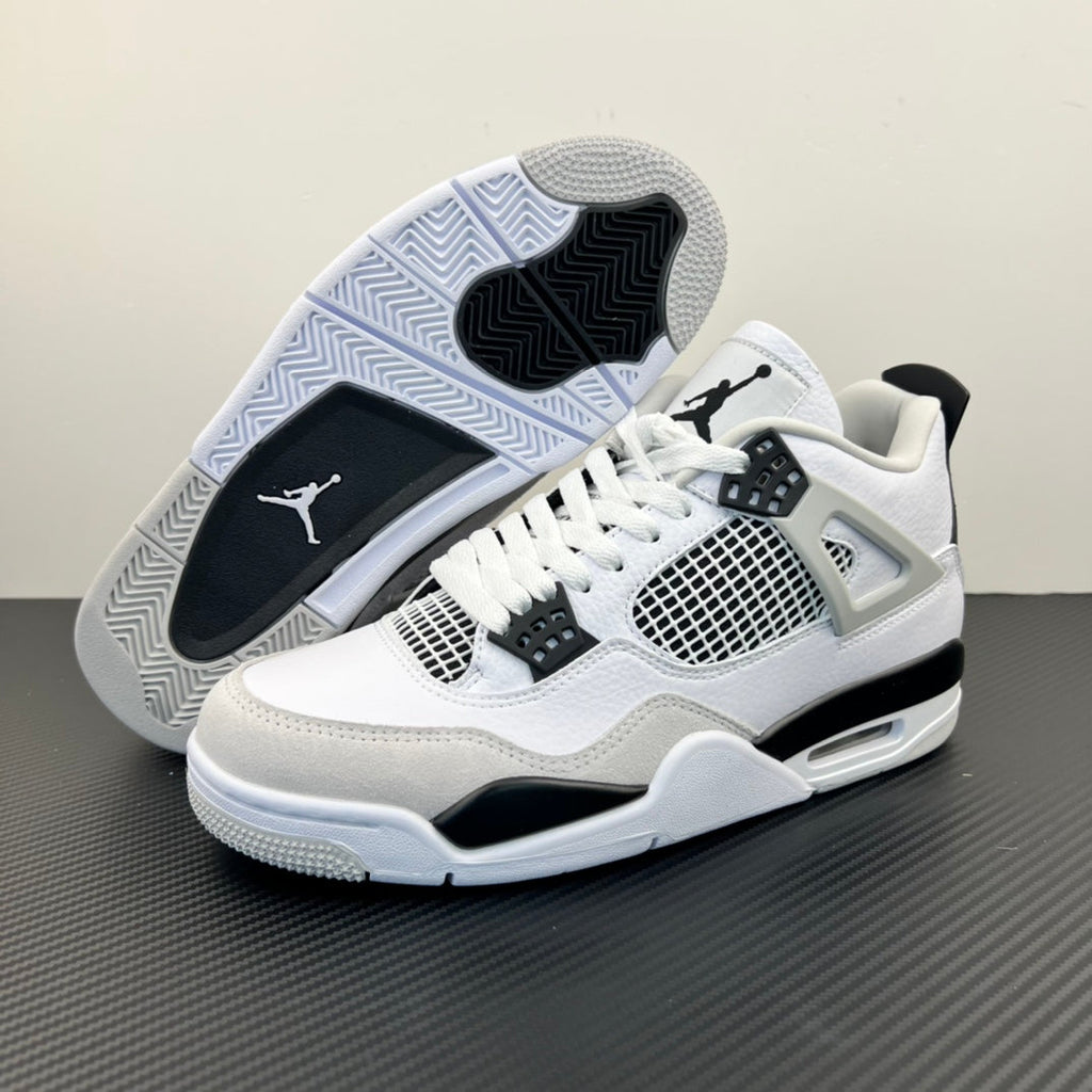 Air Jordan 4 sneaker outsole visible, with white tread pattern and black Jumpman logo