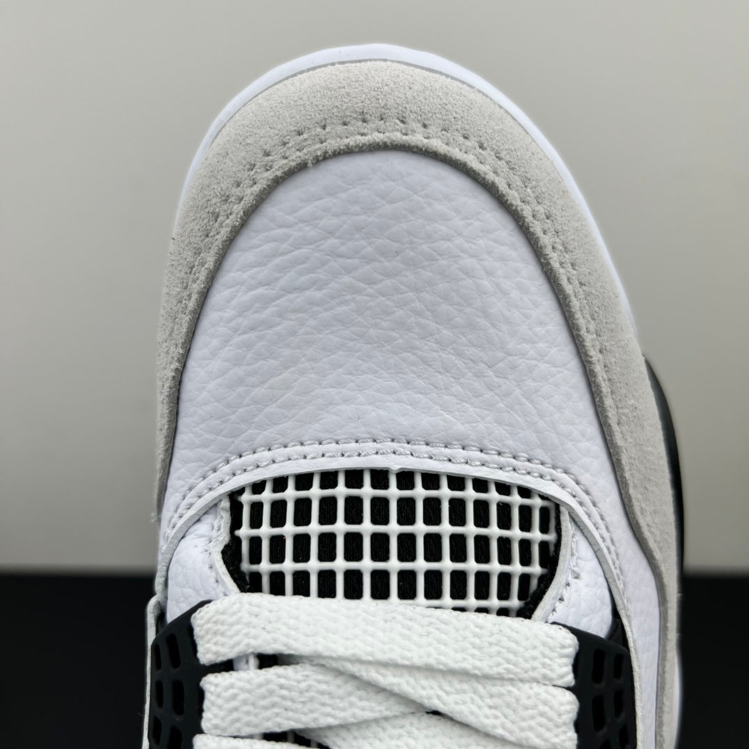 Air Jordan 4 toe area with white leather, perforated mesh panel, and lace-up overlay