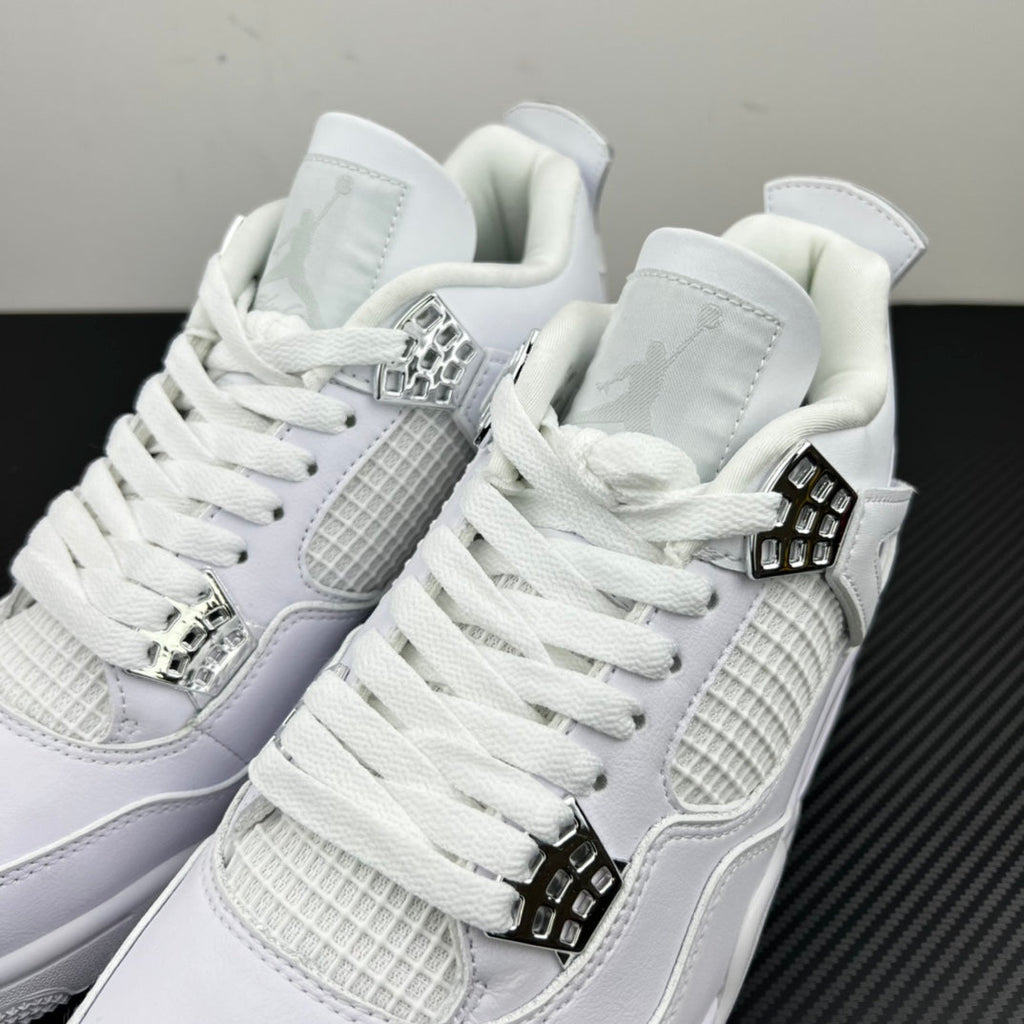 Two white Air Jordan 4 sneakers shown from the front with lace-up and buckled straps