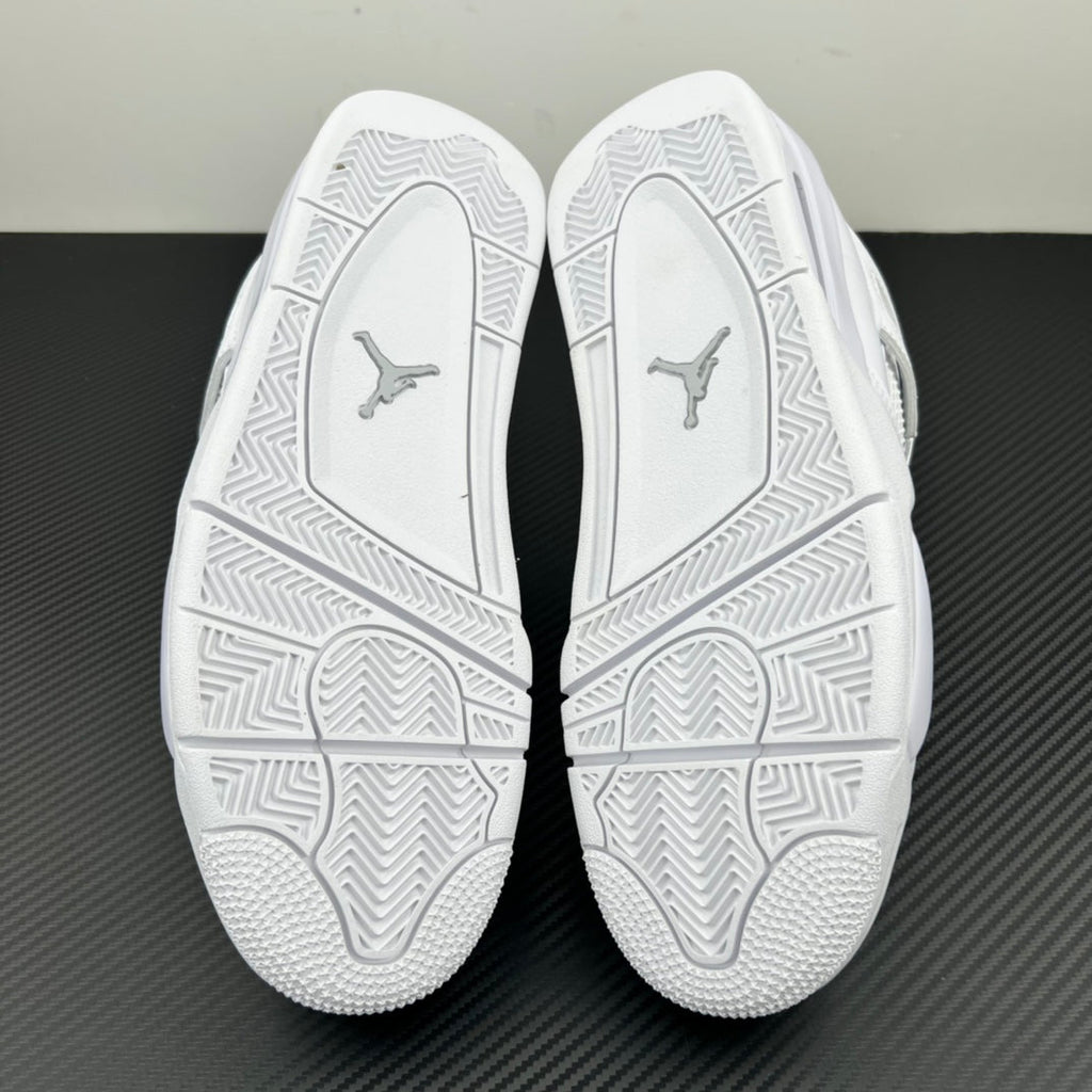 White Air Jordan 4 outsole soles with geometric tread and Jumpman logos