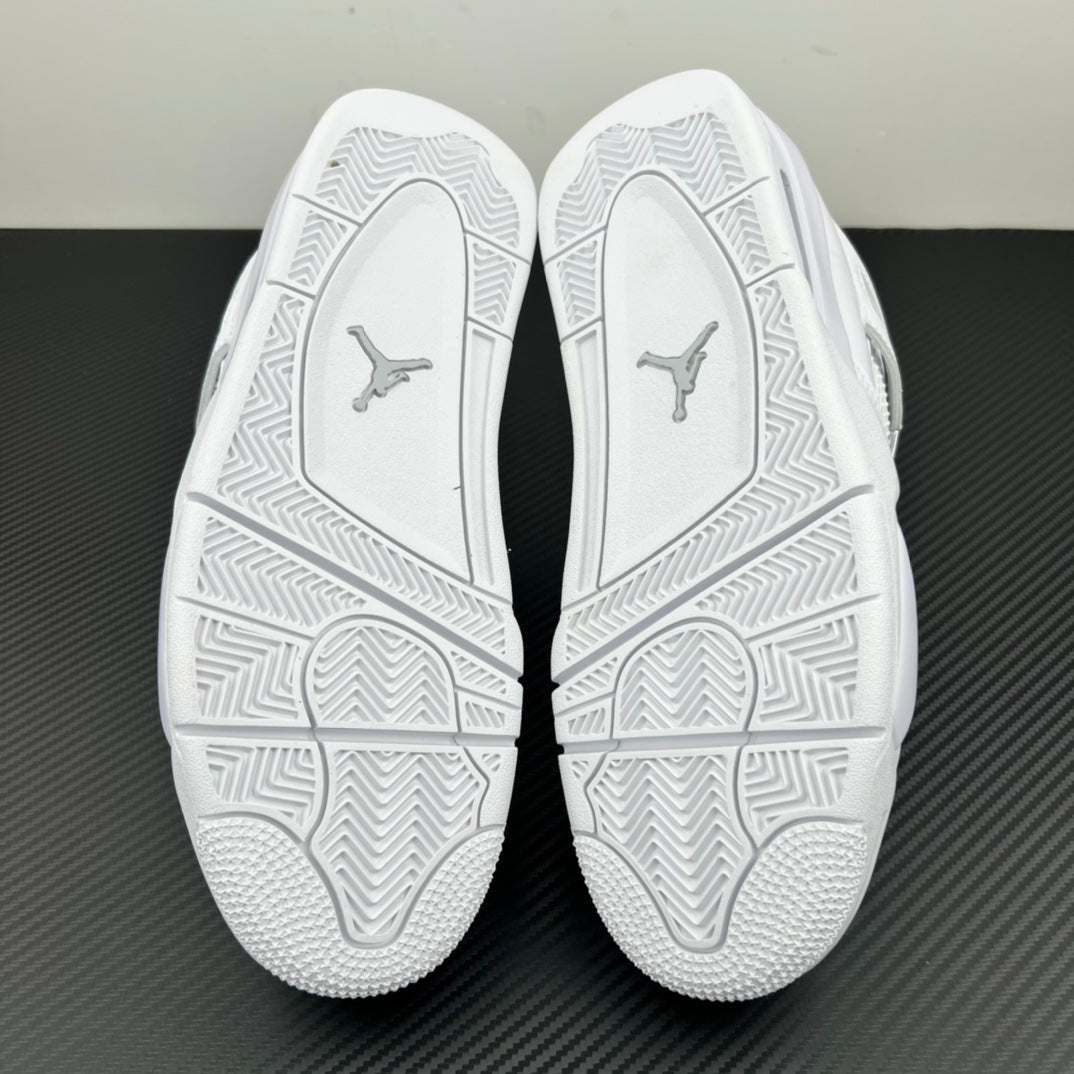 White Air Jordan 4 outsole soles with geometric tread and Jumpman logos