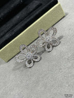Silver crystal flower stud earrings on gold box